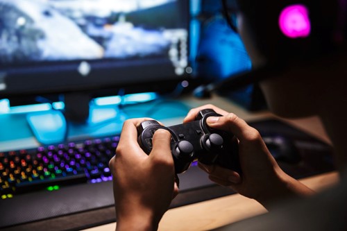a boy playing PS5 online
